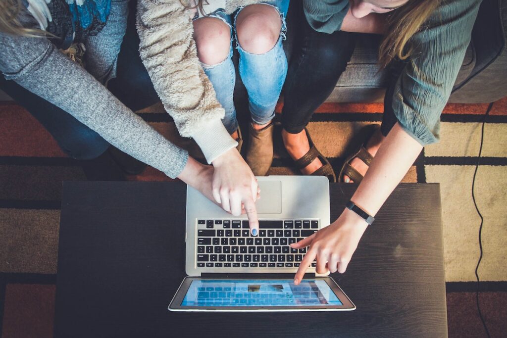 People looking at a laptop